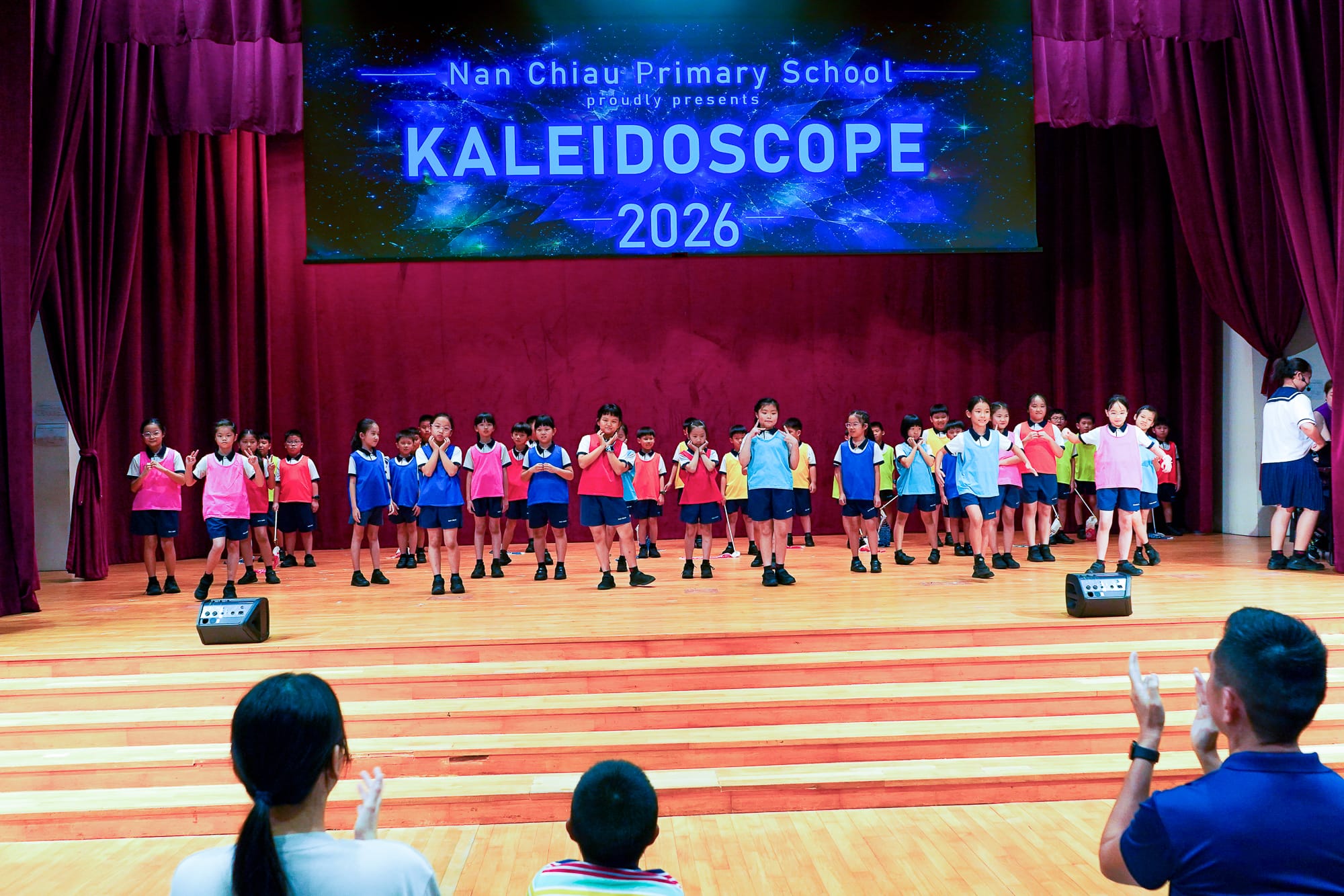 students performing on stage